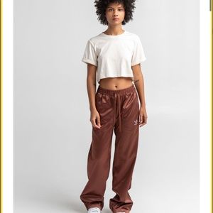 Brand New with Tags. Large Adidas wide leg pant. Got it as a gift and too big.